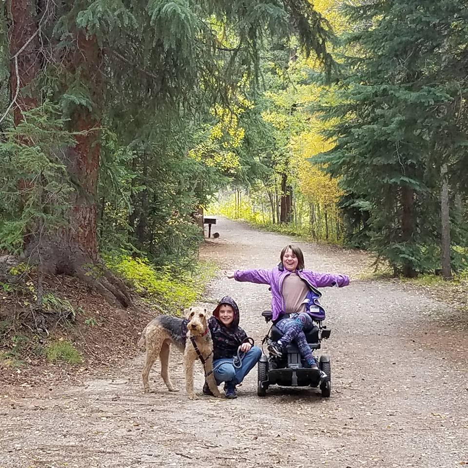 girl in motorized chair doing accessible hiking in Colorado at Wilderness on Wheels