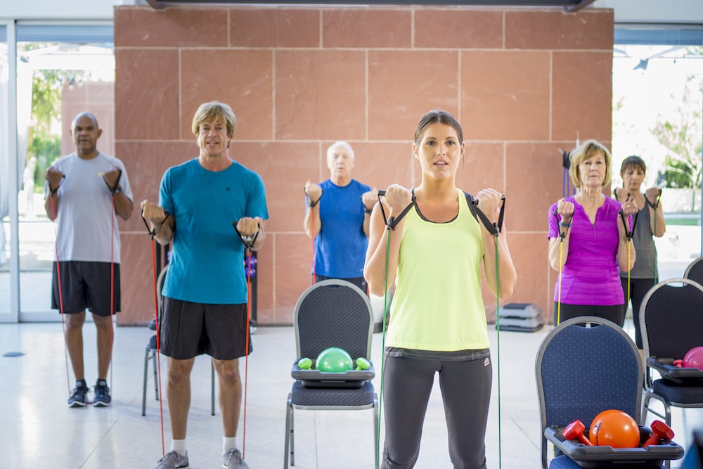 Group of people enjoying a free Silversneakers fitness class for seniors