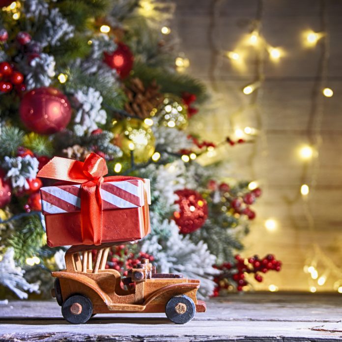 Christmas tree with toy truck and gift