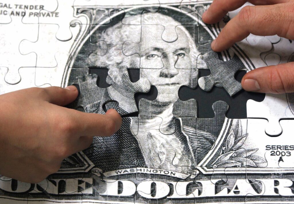 dollar in puzzle pieces