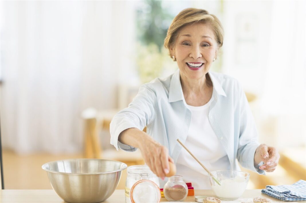 woman cooking eggs Woman cooking eggs