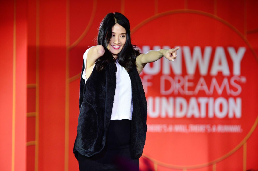 Model on runway showcasing adaptive clothing
