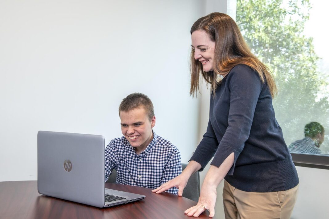 Dr. Genova working with a student at the Center for Autism Research. Credit Kessler Foundation.