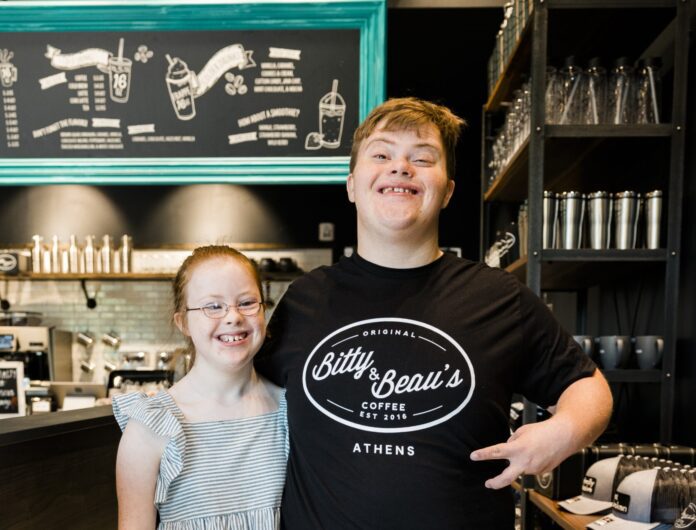 Bitty and Beau, standing in their family-run coffee shop