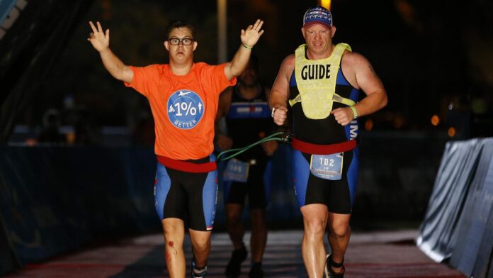 Chris Nikic is the first person with Down syndrome to complete the Ironman World Championships, with his guide.