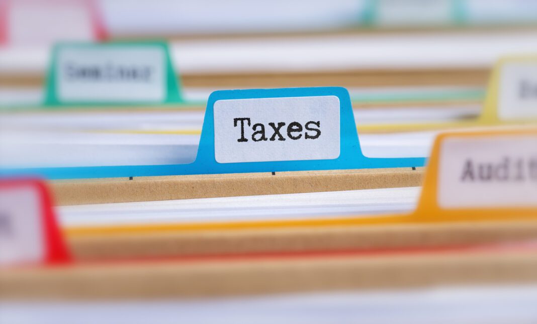 dreamstime_m_143911825 File folders with a tab labeled Taxes