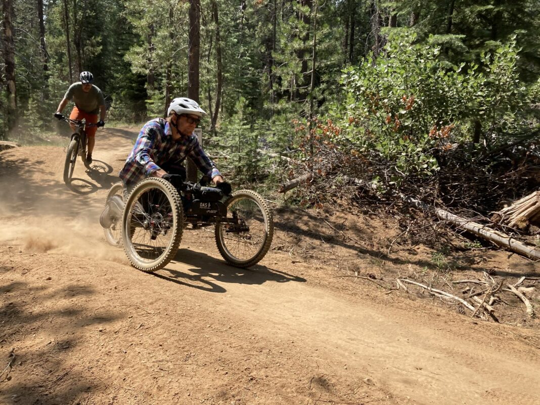 Central Oregon Trail Alliance Rider A mountain biker on an adaptive bike riding a trail near Bend, Oregon.