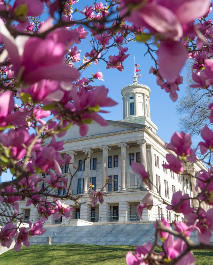 Tennessee State Capitol building on a bright, sunny first day of Spring with Magnolia flowers