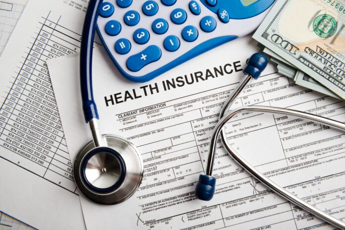 Health insurance application form with banknote and stethoscope concept for life planning