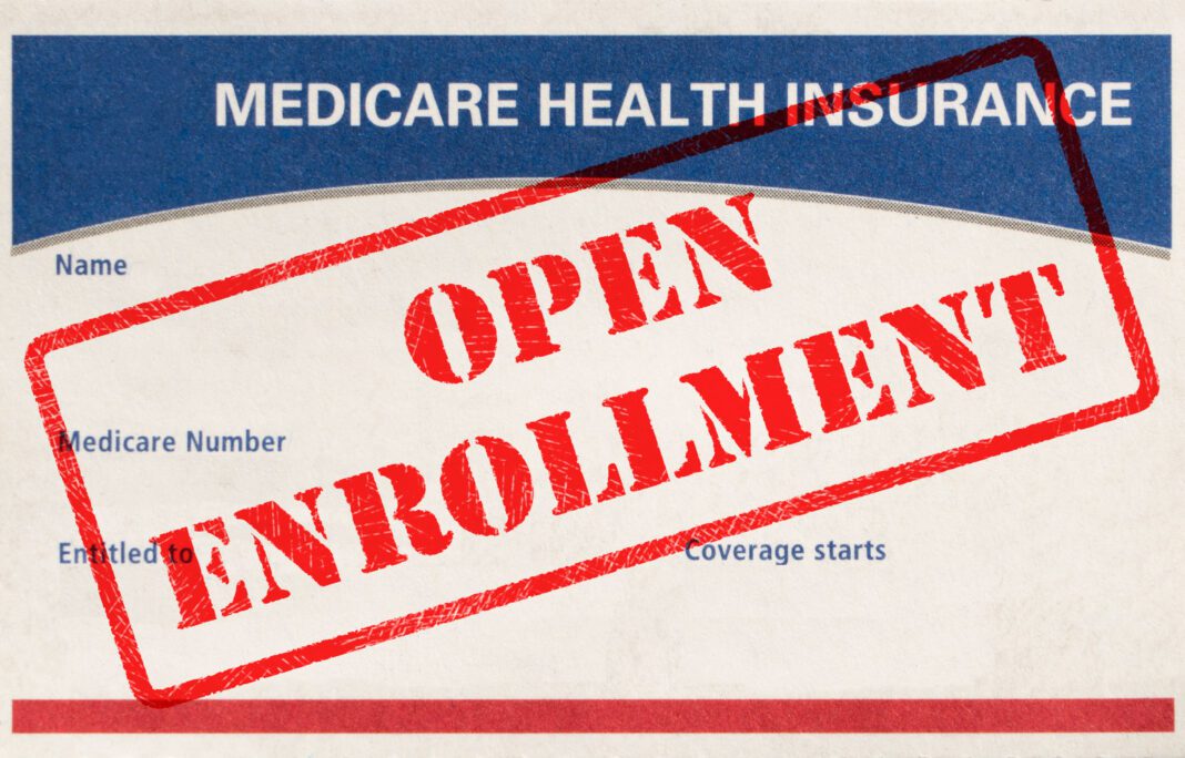 Open Enrollment Rubber Stamp On A Medicare Card