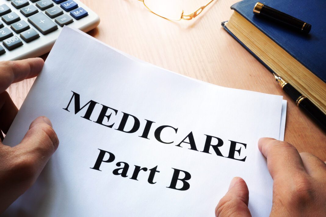 Medicare Part B paper on a desk.